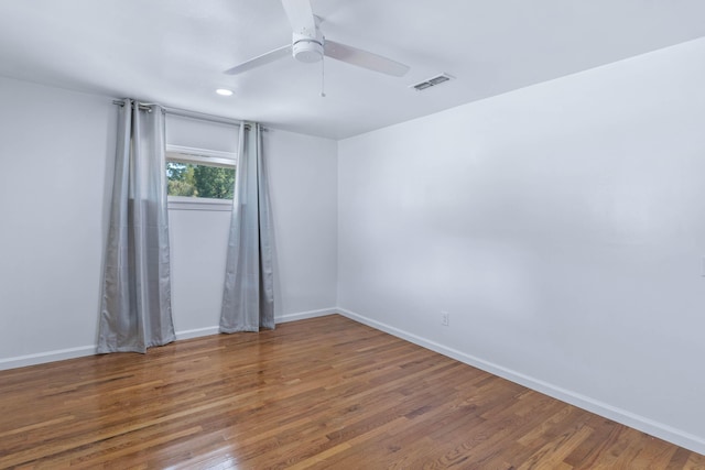 unfurnished room featuring ceiling fan and hardwood / wood-style floors