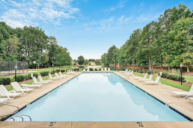 view of swimming pool featuring a patio area