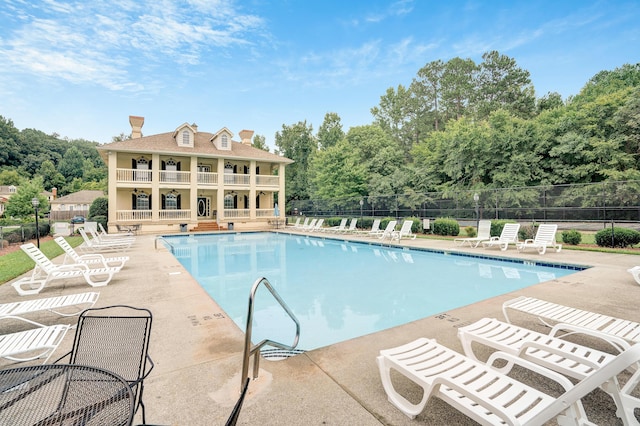 view of pool featuring a patio