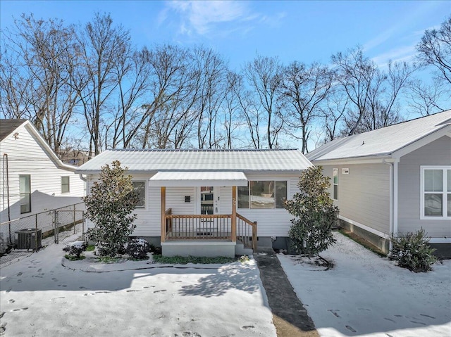 view of front of property with central AC unit and covered porch