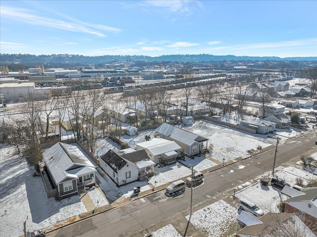 snowy aerial view with a mountain view