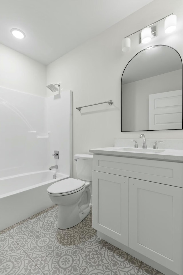 full bathroom featuring tile patterned floors, vanity, toilet, and bathtub / shower combination