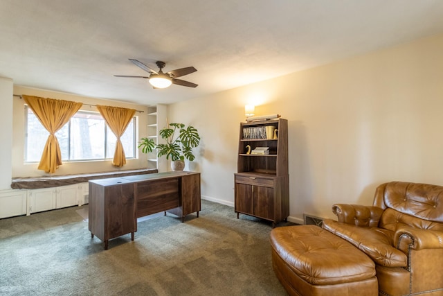 carpeted office featuring ceiling fan