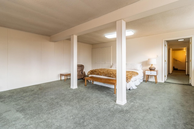 unfurnished bedroom with a textured ceiling and carpet flooring