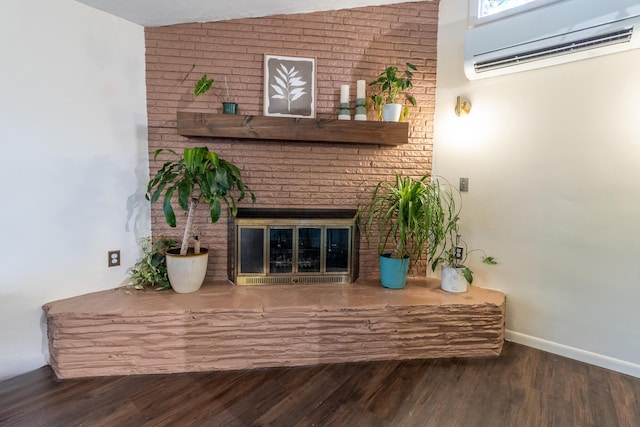 living room featuring lofted ceiling, dark hardwood / wood-style flooring, a wall mounted AC, and a brick fireplace