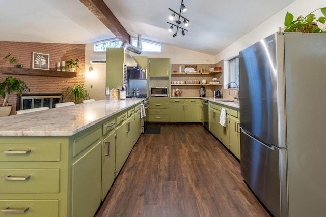 kitchen with sink, dark wood-type flooring, stainless steel appliances, lofted ceiling with beams, and green cabinetry