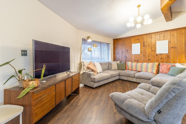 living room with vaulted ceiling, dark hardwood / wood-style floors, and a notable chandelier