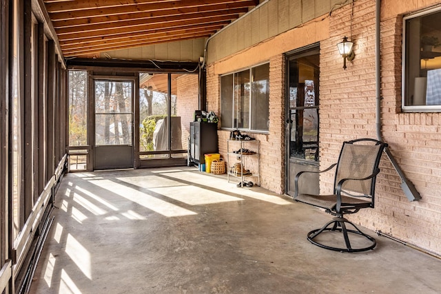 unfurnished sunroom with vaulted ceiling