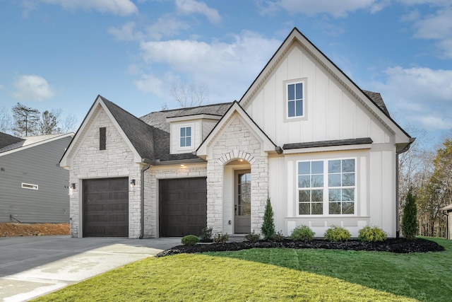 view of front facade with a front yard and a garage