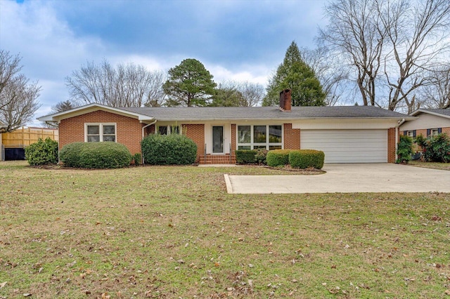 ranch-style house featuring a front lawn and a garage