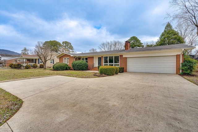 ranch-style house with a front lawn and a garage