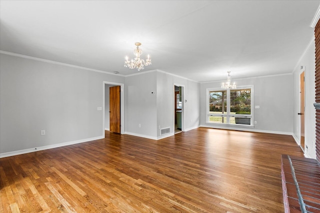 unfurnished living room featuring wood-type flooring, ornamental molding, and a notable chandelier