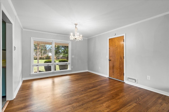 empty room with an inviting chandelier, ornamental molding, and dark hardwood / wood-style floors