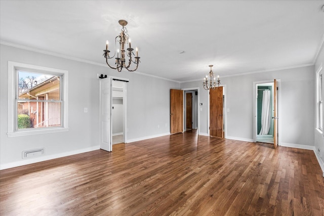 interior space with ornamental molding, a notable chandelier, and dark hardwood / wood-style floors