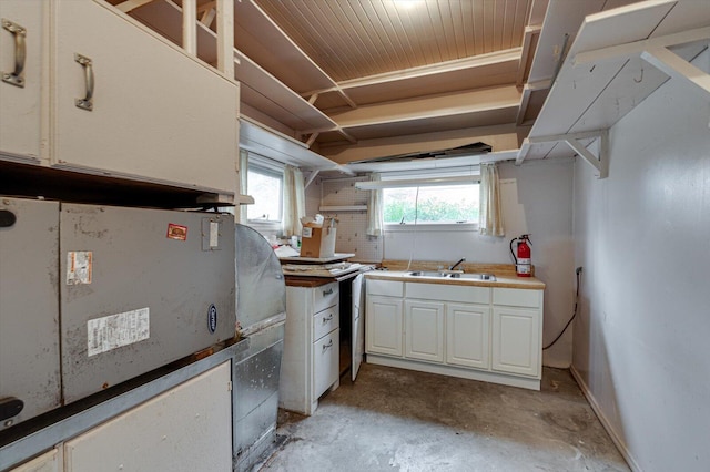 kitchen featuring sink and white cabinetry