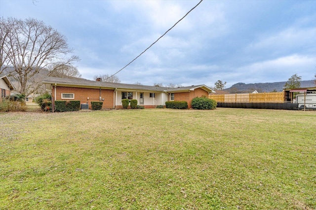 back of property featuring a lawn