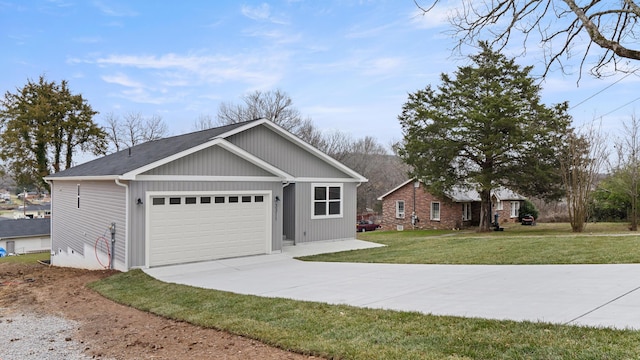 view of front facade featuring a front yard and a garage