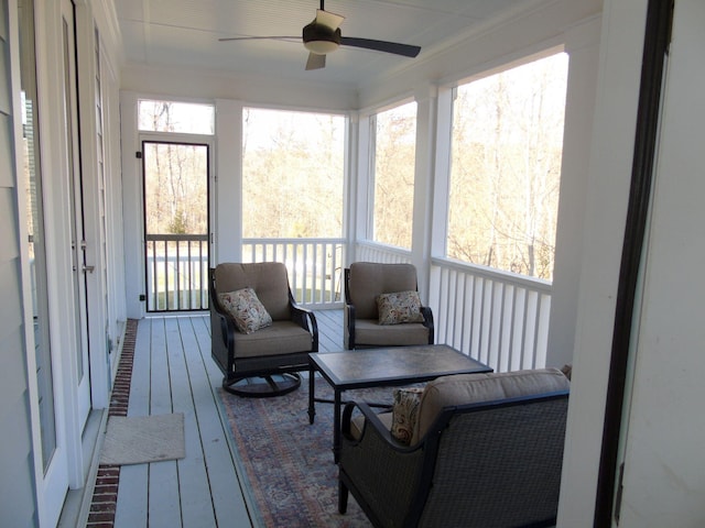 sunroom with ceiling fan and a wealth of natural light