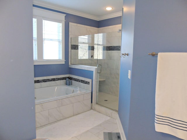 bathroom with crown molding and separate shower and tub