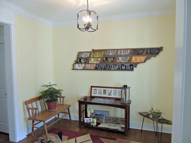 interior space with an inviting chandelier, crown molding, and dark wood-type flooring