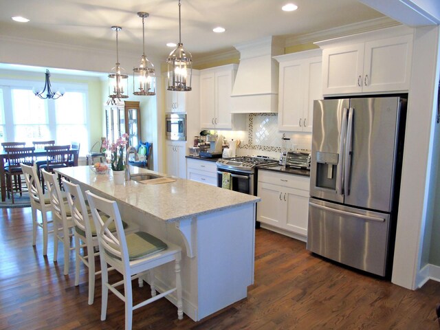 807 Blissfield Ct, Chattanooga, TN 37419 - kitchen featuring stainless steel appliances, custom exhaust hood, ornamental molding, a chandelier, and white cabinetry