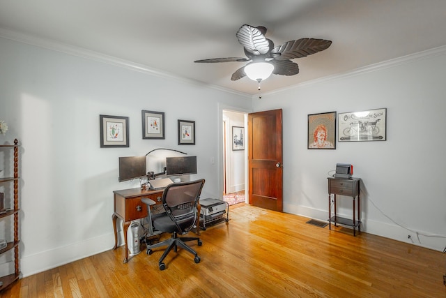 office with ceiling fan, crown molding, and light hardwood / wood-style flooring