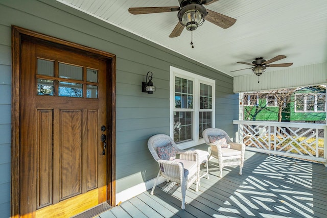 wooden deck featuring ceiling fan and a porch