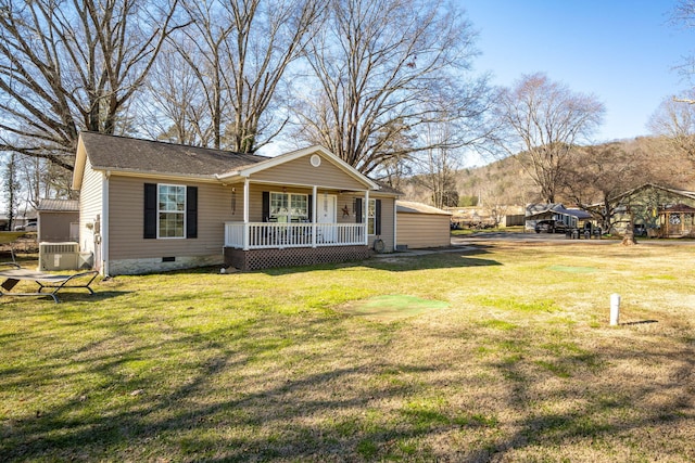 view of front facade with a front yard, a porch, and a mountain view