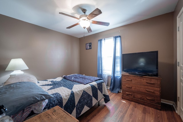 bedroom featuring hardwood / wood-style floors and ceiling fan