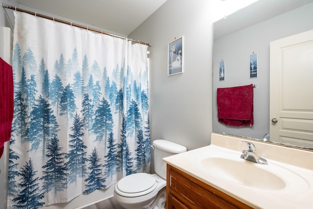 bathroom with hardwood / wood-style floors, vanity, a shower with shower curtain, and toilet