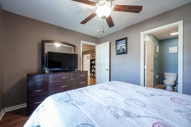 bedroom featuring dark hardwood / wood-style flooring, ensuite bathroom, and ceiling fan