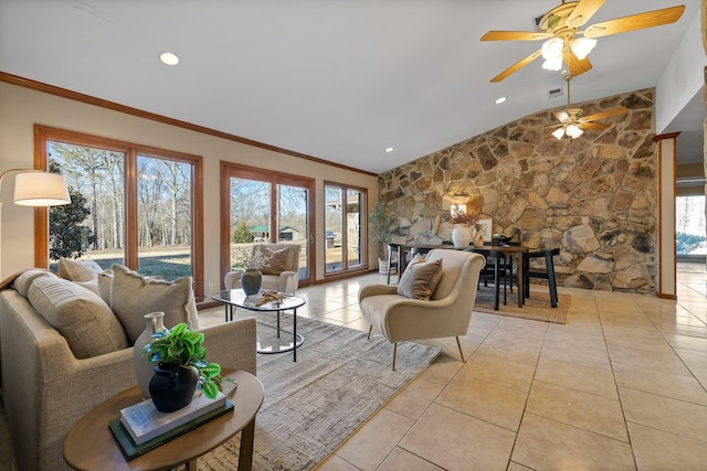 tiled living room featuring ornamental molding and plenty of natural light