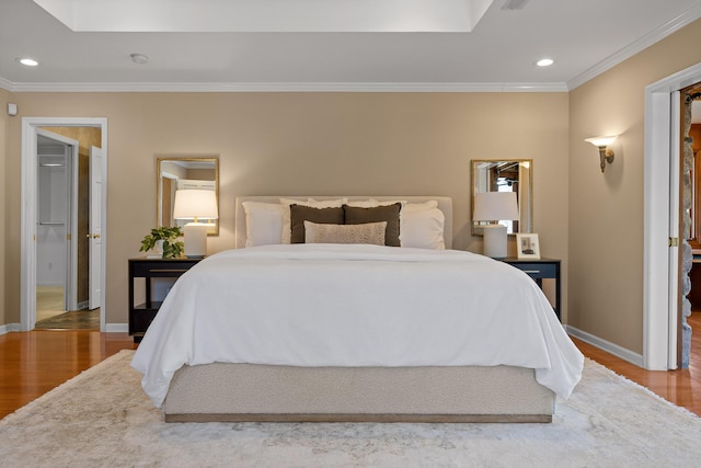 bedroom featuring wood-type flooring and ornamental molding