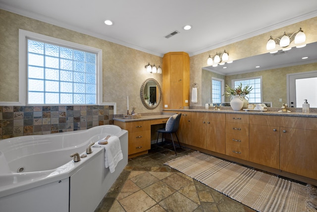 bathroom with ornamental molding, vanity, and plenty of natural light