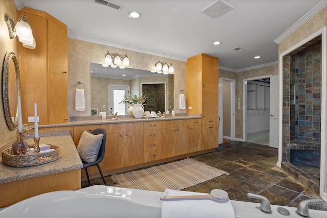 bathroom featuring ornamental molding and vanity