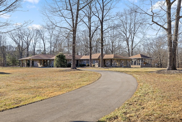 ranch-style house featuring a gazebo and a front yard