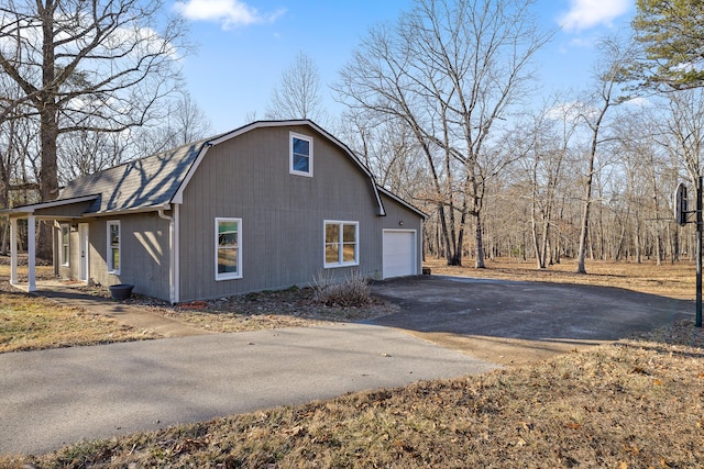 view of side of home featuring a garage