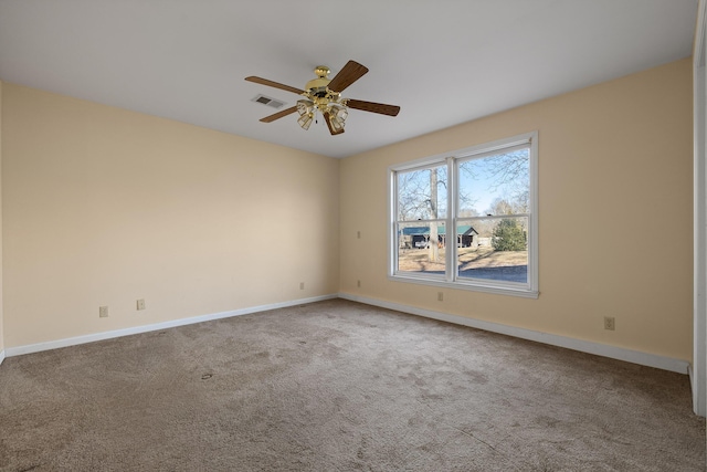 empty room with ceiling fan and carpet flooring