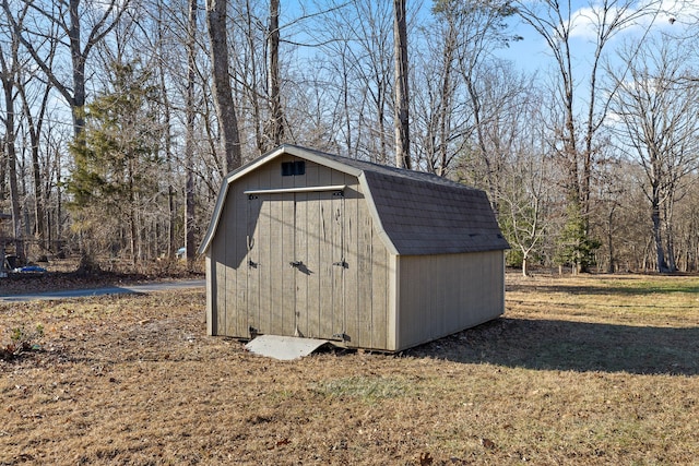 view of outbuilding with a lawn