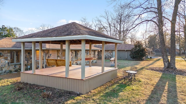 wooden deck with a lawn