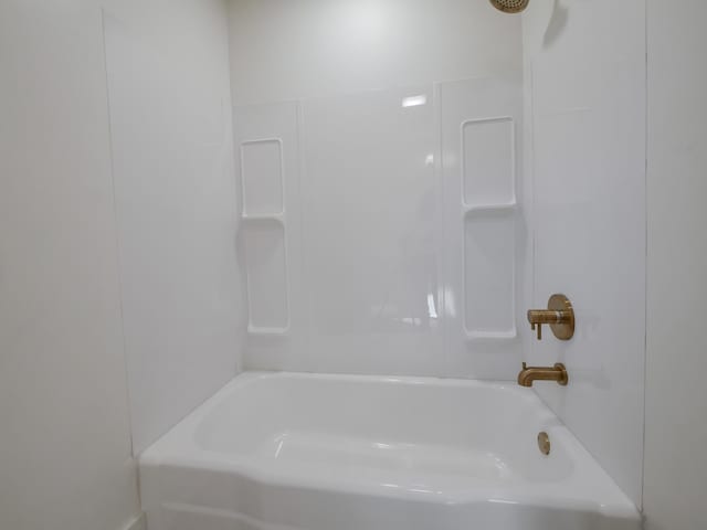 bathroom with shower / bath combination