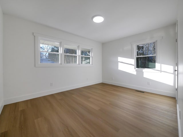 spare room with light wood-type flooring