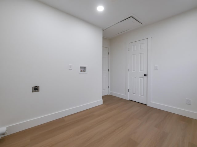 empty room with light hardwood / wood-style flooring