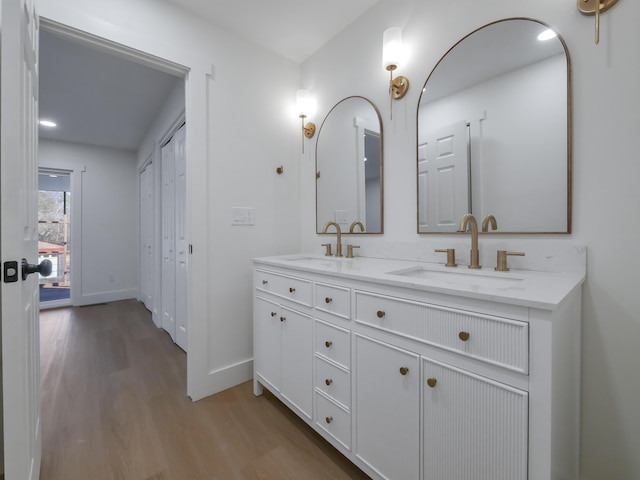 bathroom with vanity and hardwood / wood-style flooring