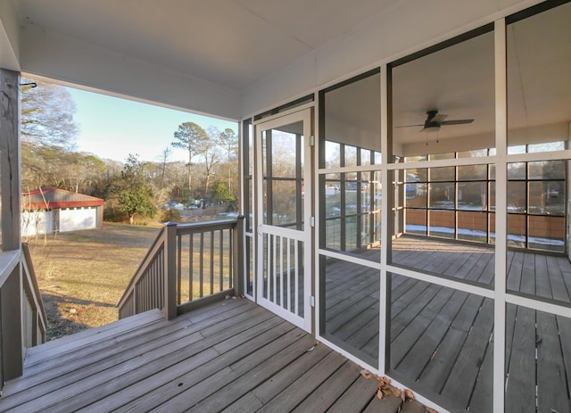 wooden terrace featuring ceiling fan