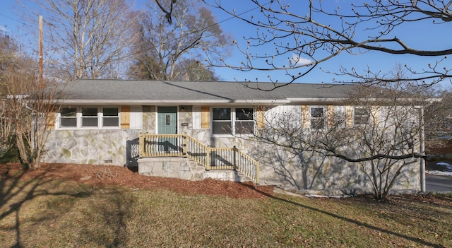 ranch-style home with a front lawn