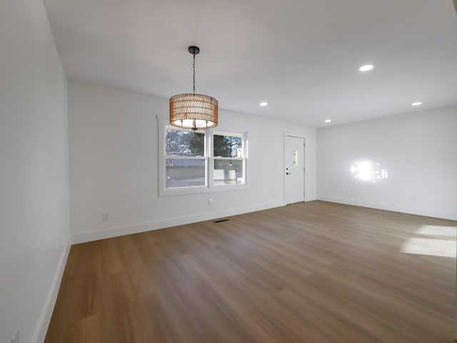 empty room with wood-type flooring