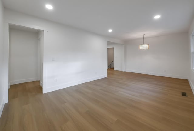 spare room with light wood-type flooring