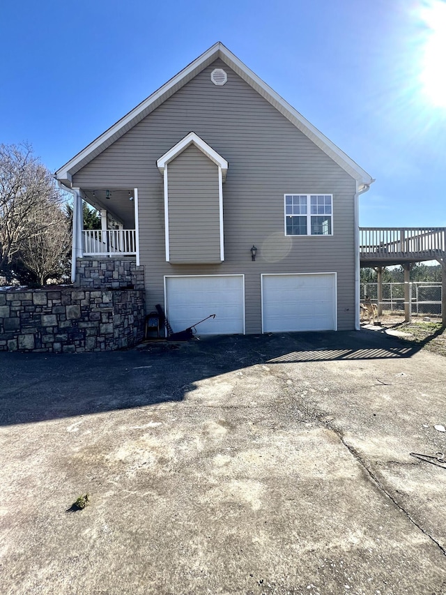 view of side of home with a garage