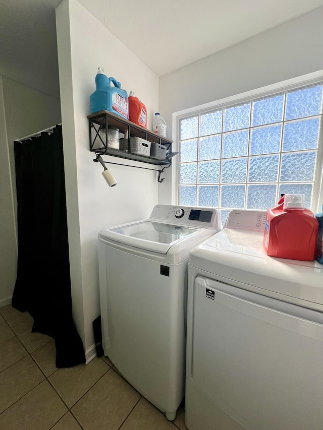 washroom featuring light tile patterned floors and separate washer and dryer